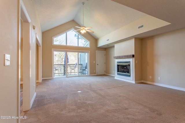 unfurnished living room featuring light carpet, baseboards, visible vents, a ceiling fan, and a tiled fireplace