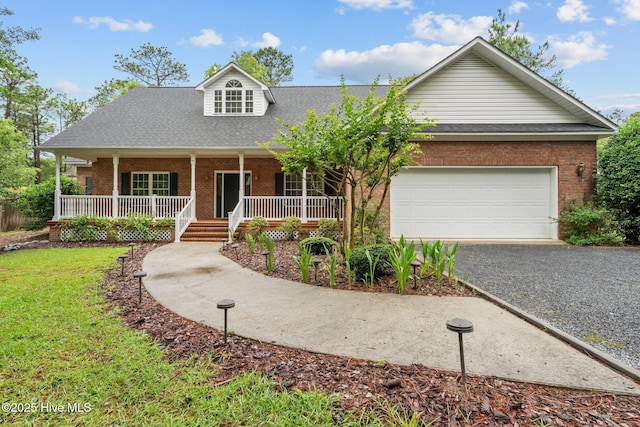 10 Lodge Pole Ln, Pinehurst, NC 28374 - view of front of house featuring brick siding, asphalt driveway, an attached garage, a porch, and a shingled roof