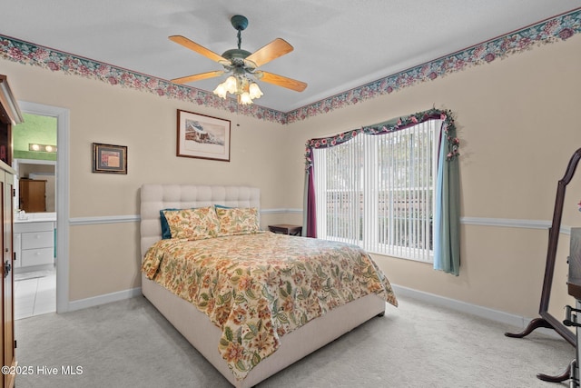 10 Lodge Pole Ln, Pinehurst, NC 28374 - carpeted bedroom featuring multiple windows, baseboards, connected bathroom, and ceiling fan