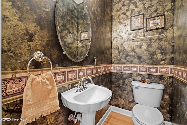 10 Lodge Pole Ln, Pinehurst, NC 28374 - bathroom with toilet, wood finished floors, wallpapered walls, and a sink