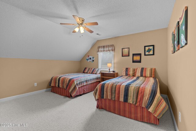 10 Lodge Pole Ln, Pinehurst, NC 28374 - bedroom featuring lofted ceiling, ceiling fan, carpet floors, baseboards, and a textured ceiling