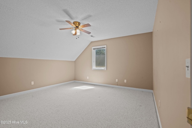 10 Lodge Pole Ln, Pinehurst, NC 28374 - additional living space with a ceiling fan, baseboards, a textured ceiling, vaulted ceiling, and carpet floors