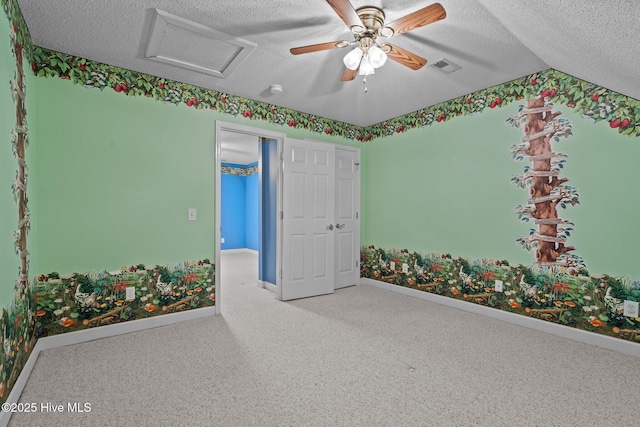 10 Lodge Pole Ln, Pinehurst, NC 28374 - unfurnished bedroom with a textured ceiling, baseboards, carpet flooring, attic access, and ceiling fan