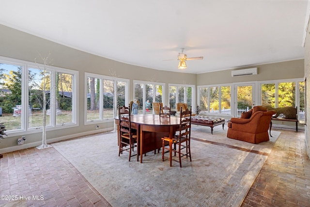 sunroom / solarium featuring a ceiling fan and a wall mounted air conditioner