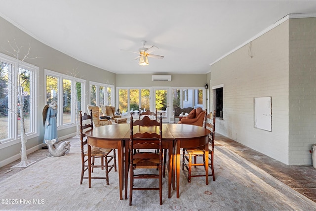 dining area featuring ornamental molding, a wall mounted air conditioner, ceiling fan, and brick wall