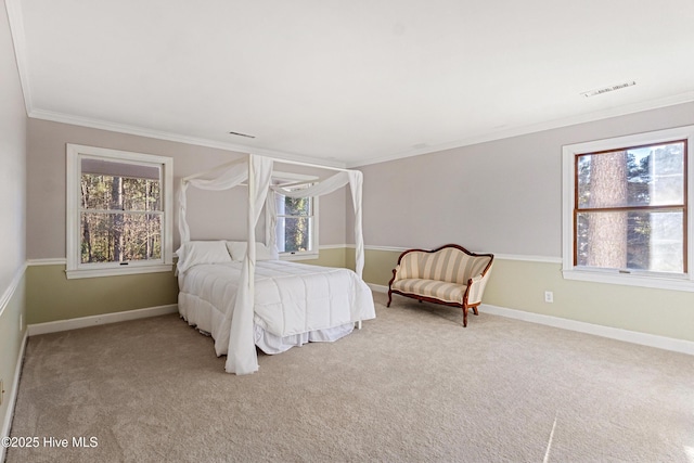 bedroom featuring baseboards, multiple windows, and visible vents