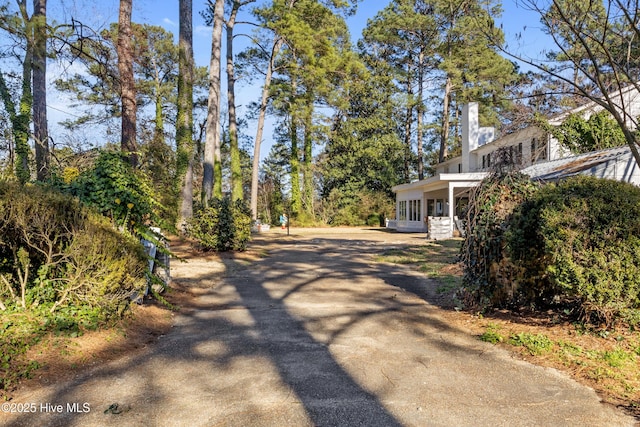 view of street with aphalt driveway