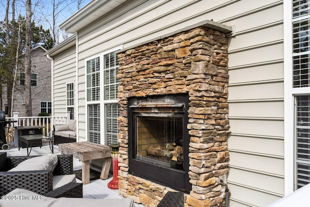 exterior space with an outdoor stone fireplace