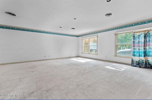 5200 Pineview Rd, Lumberton, NC 28360 - carpeted empty room with a textured ceiling and baseboards
