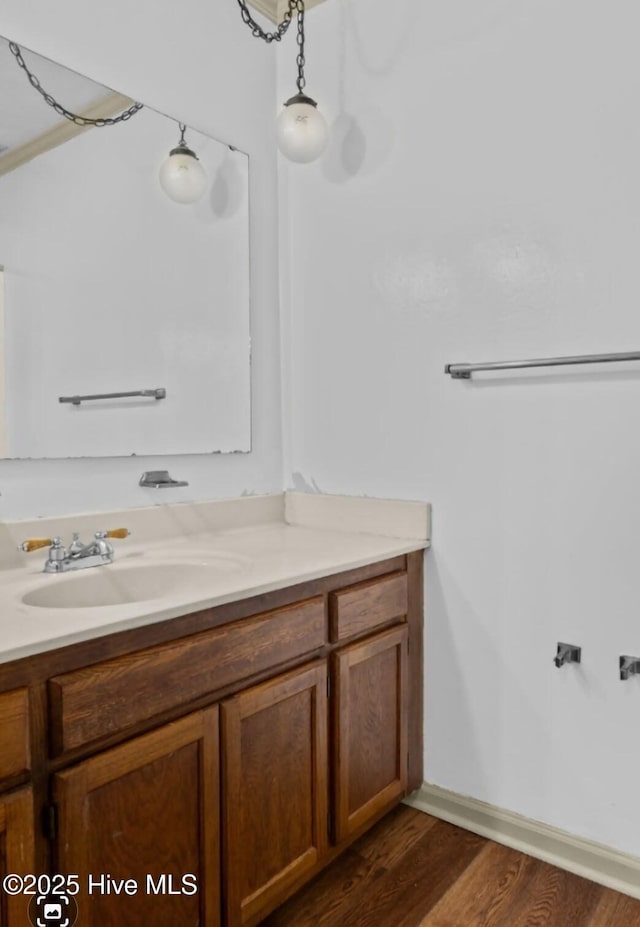 5200 Pineview Rd, Lumberton, NC 28360 - bathroom featuring vanity, wood finished floors, and baseboards