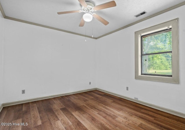 5200 Pineview Rd, Lumberton, NC 28360 - unfurnished room with crown molding, wood finished floors, baseboards, and ceiling fan