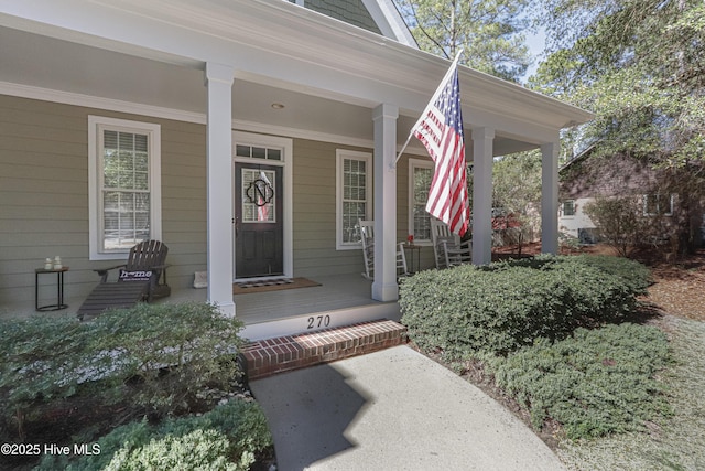 doorway to property with covered porch