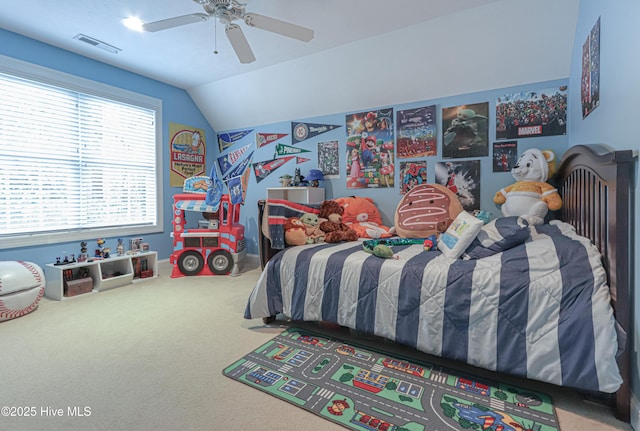 carpeted bedroom featuring lofted ceiling, ceiling fan, and visible vents