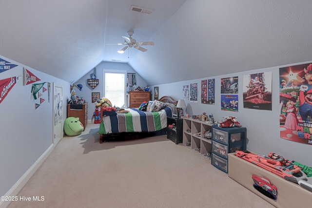 carpeted bedroom featuring lofted ceiling, ceiling fan, visible vents, and baseboards