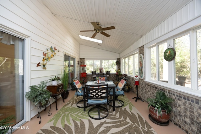 sunroom with lofted ceiling with skylight and wooden ceiling