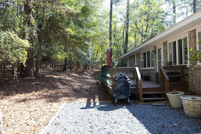 view of yard featuring a wooden deck