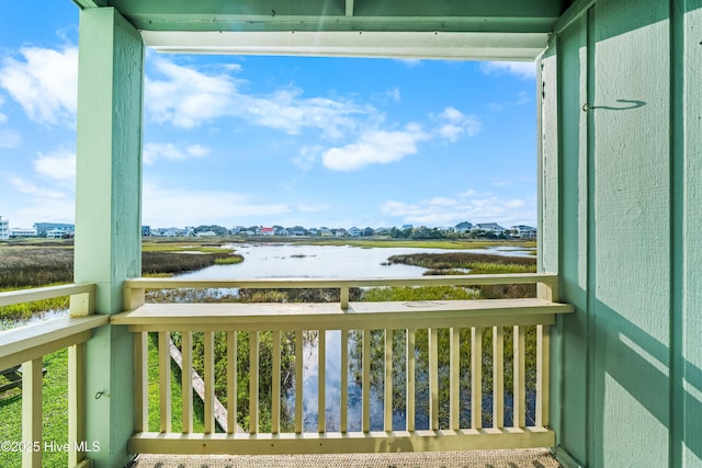 balcony featuring a water view