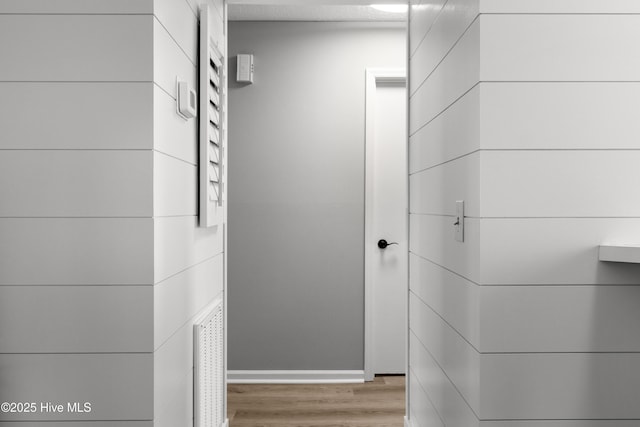 hallway with wood finished floors