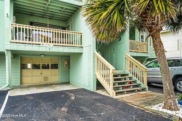 view of exterior entry with an attached garage