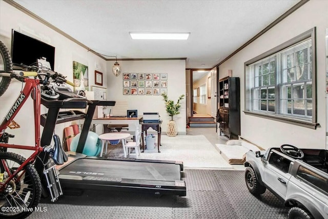 workout room with ornamental molding