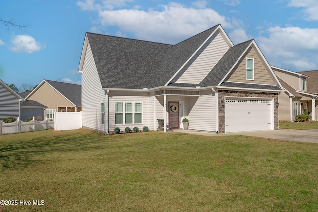 craftsman inspired home with an attached garage, a shingled roof, fence, driveway, and a front lawn