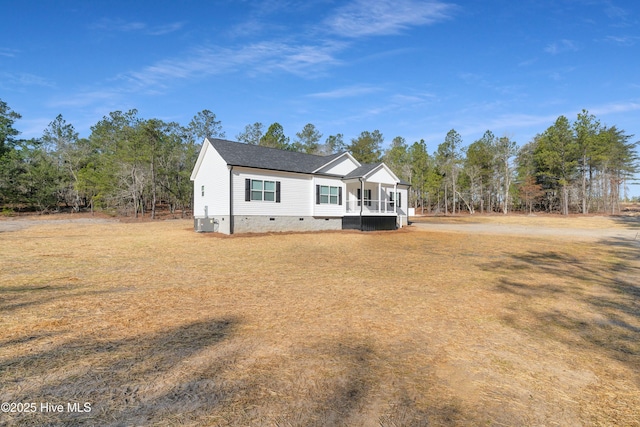 view of front of house featuring central AC, a porch, crawl space, and a front yard