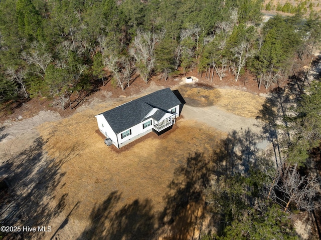 bird's eye view featuring a forest view