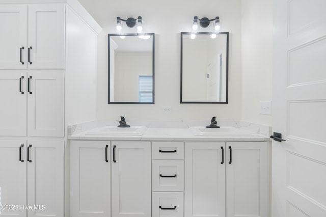 bathroom with double vanity and a sink