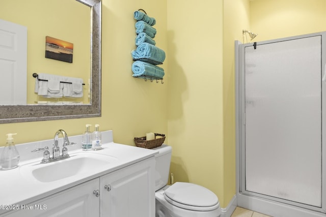 full bath with toilet, a stall shower, tile patterned flooring, and vanity