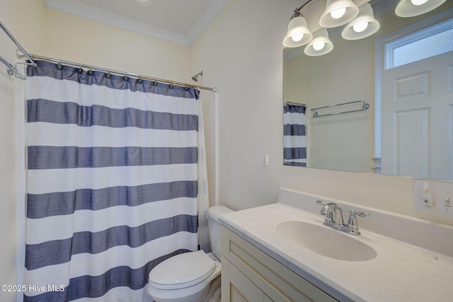 full bath featuring toilet, curtained shower, ornamental molding, and vanity