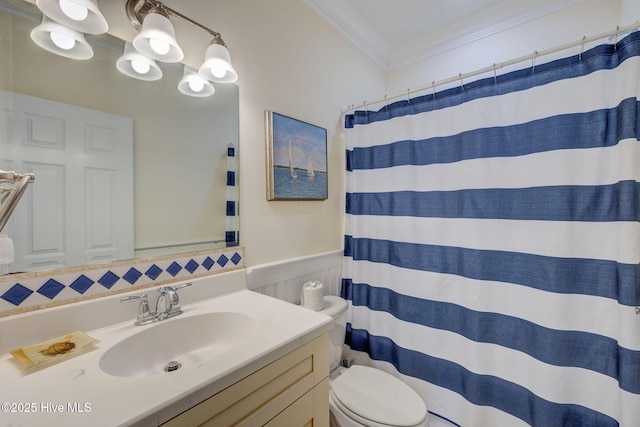 full bathroom with crown molding, a shower with shower curtain, toilet, wainscoting, and vanity