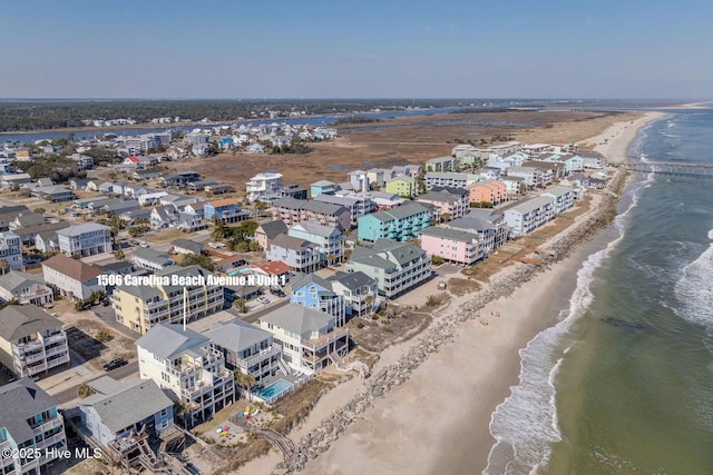 aerial view featuring a water view and a view of the beach