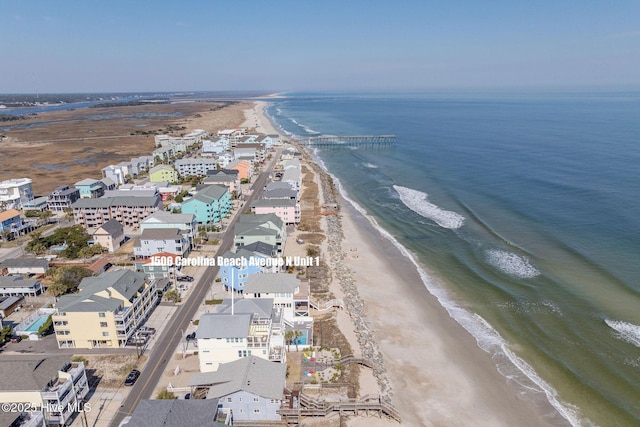 bird's eye view with a water view and a view of the beach