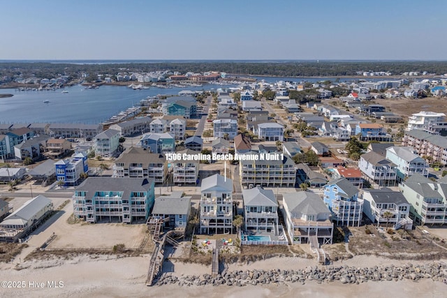 birds eye view of property featuring a water view