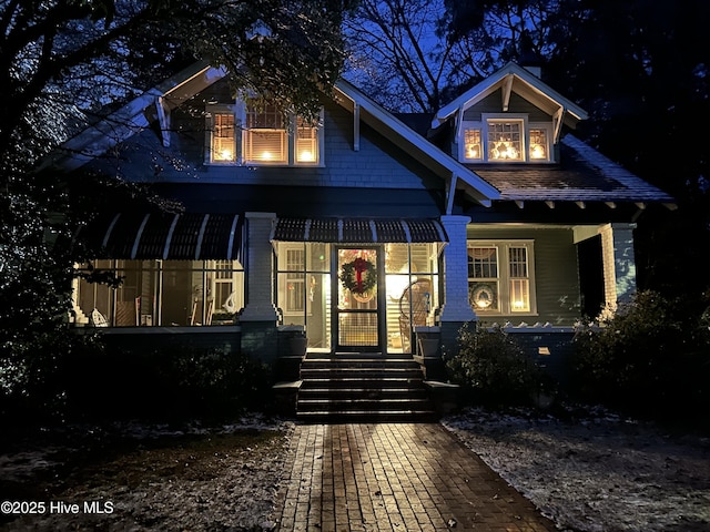 view of front of property featuring brick siding