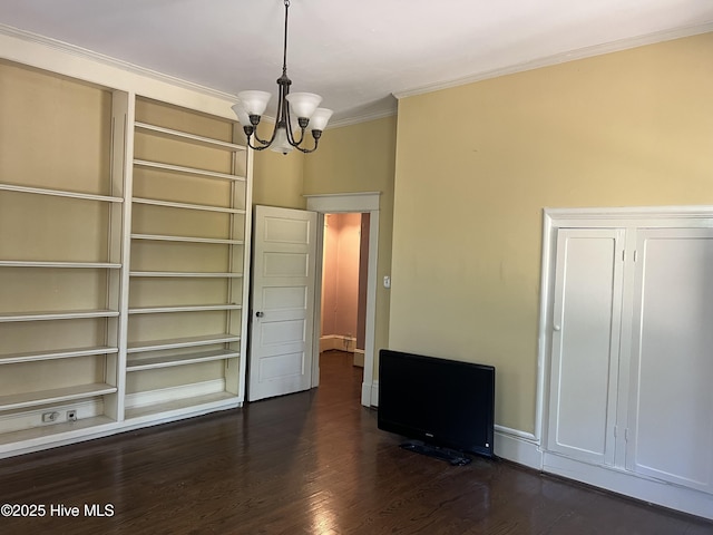 unfurnished dining area featuring ornamental molding, a notable chandelier, and dark wood-style floors