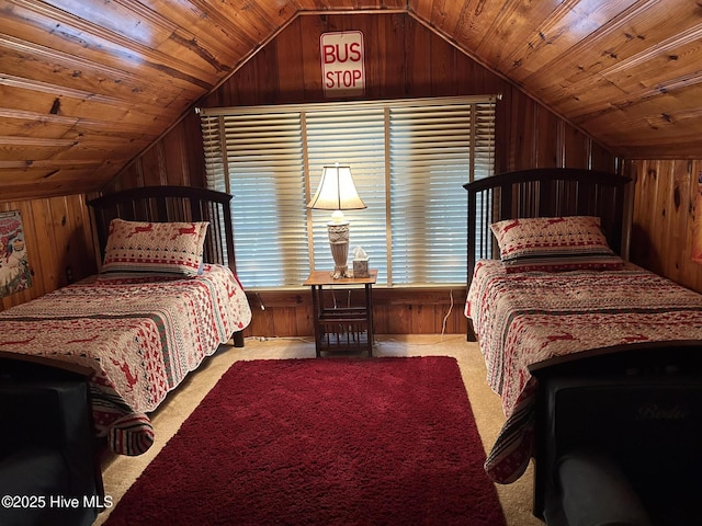 bedroom with wooden ceiling, carpet, and wooden walls