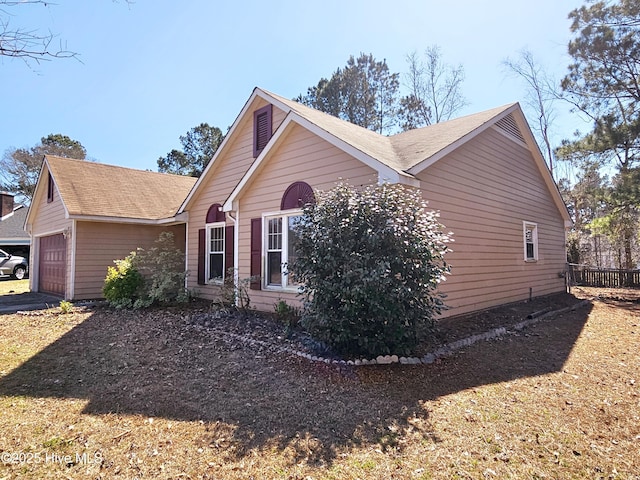 view of side of property featuring a garage