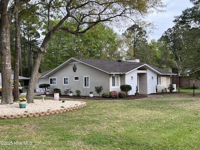 2 Arden Pl, Carolina Shores, NC 28467 - single story home with a front lawn, a chimney, and a shingled roof