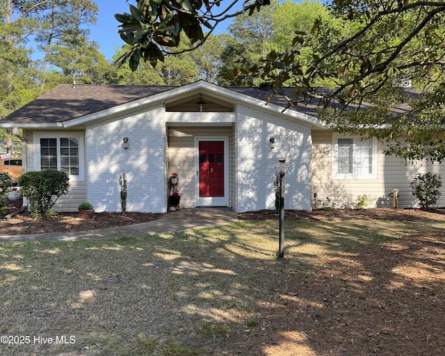 2 Arden Pl, Carolina Shores, NC 28467 - view of front of home with brick siding and a shingled roof
