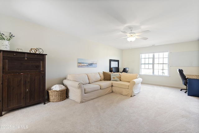 living room featuring a ceiling fan, light carpet, and baseboards