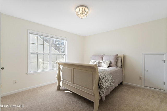 carpeted bedroom with baseboards