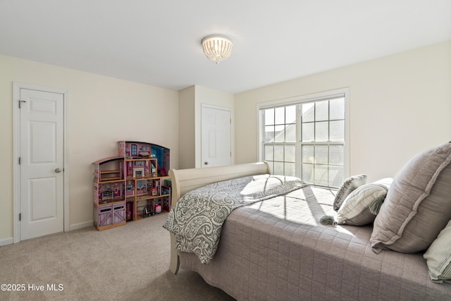 bedroom with carpet and baseboards