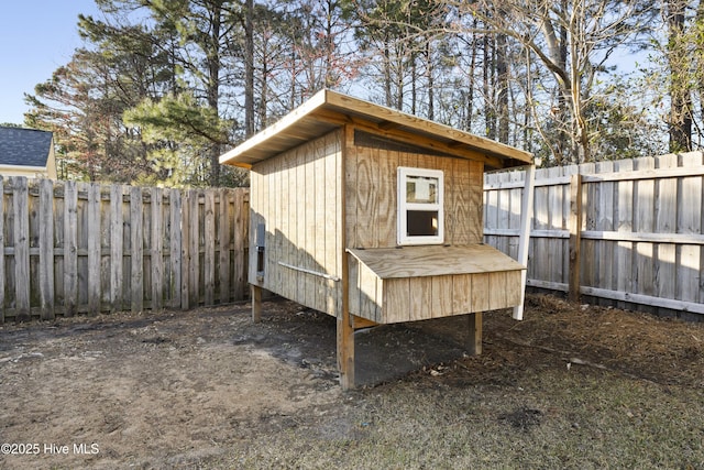 view of poultry coop with a fenced backyard