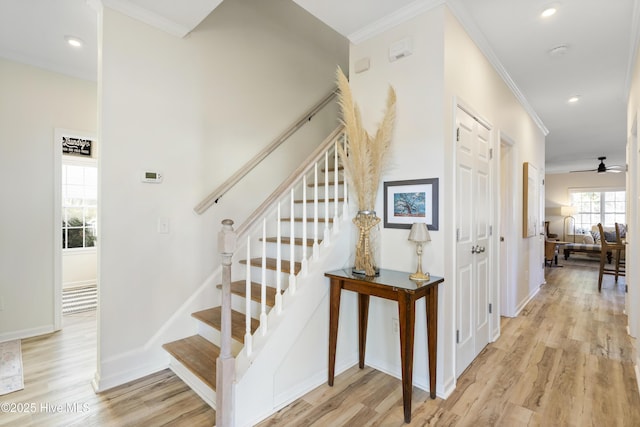 staircase featuring baseboards, recessed lighting, wood finished floors, and crown molding