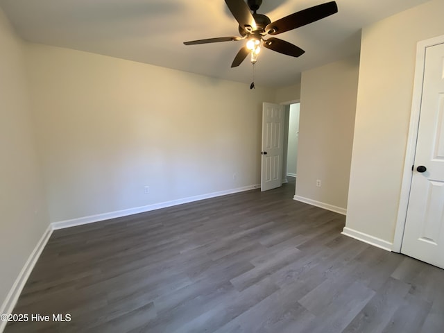 unfurnished bedroom with ceiling fan, baseboards, and dark wood finished floors