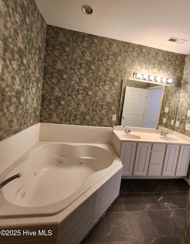 full bathroom with wallpapered walls, visible vents, and a sink