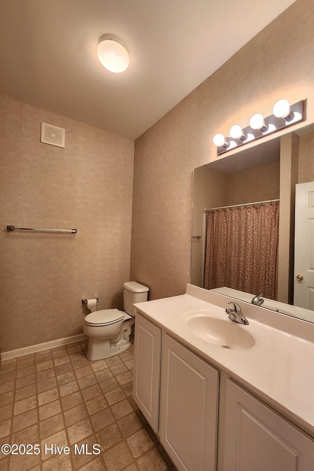 full bath with visible vents, a shower with shower curtain, toilet, tile patterned floors, and vanity