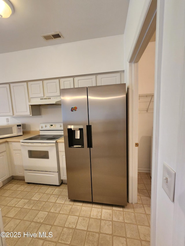 kitchen featuring under cabinet range hood, white appliances, visible vents, white cabinets, and light countertops