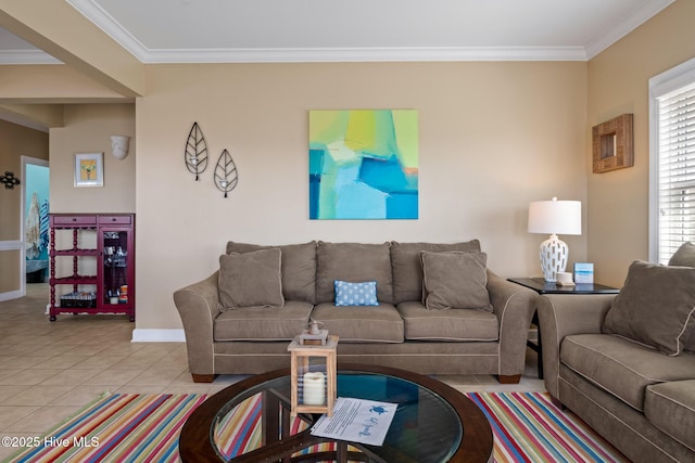 living area featuring ornamental molding, tile patterned flooring, and baseboards